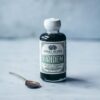 Botella de elixir detox Anima Mundi con moringa y chlorella orgánica