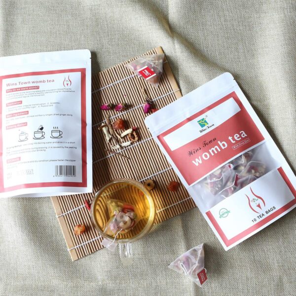 Vista general caja y bolsas té herbal Wins Town Womb mujer