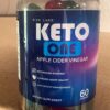 Frasco abierto con gomitas Keto One ACV para pérdida de peso